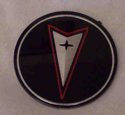 Fiero Wheel Cap Center Emblems (4) - NOS